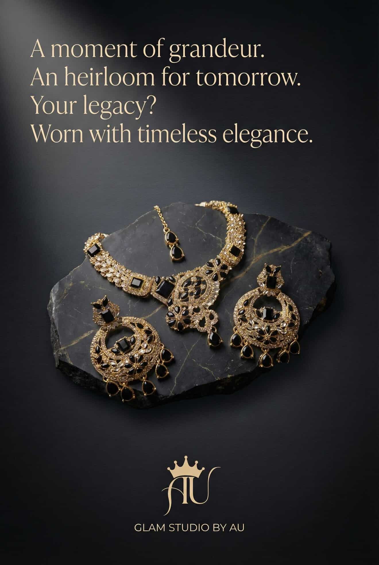 Gold jewelry set on a dark stone surface with promotional text and Glam Studio by AU logo.